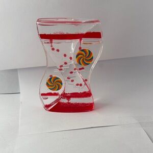 Clear Hourglass Liquid Timer with Red Liquid and Colorful Swirls